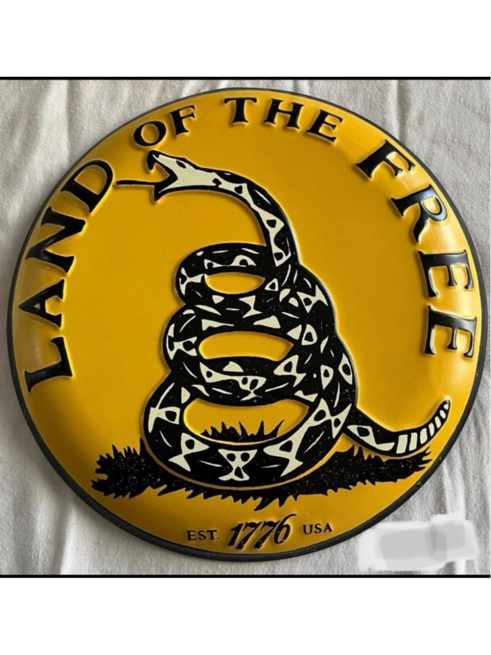 NEW 12” metal round “Land of the free” sign
